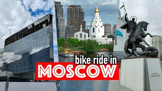 Bicycle walk Moscow. Pedestrian bridge in Krasnogorsk, embankment, Crocus City.