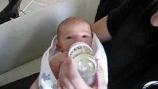 Asher's first bottle feed with Dad