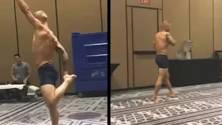 TJ Dillashaw stretching backstage getting ready for Cody Garbrandt rematch