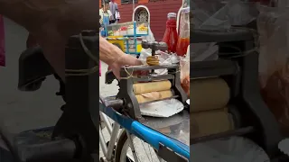 MAN SELLS DRIED SQUID FROM PUSH BIKE BANGKOK THAILAND