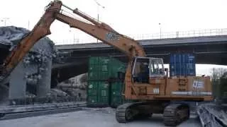 Bridge demolition - Liebherr R962HD and Cat 336E are loading debris out of ships - Part 1