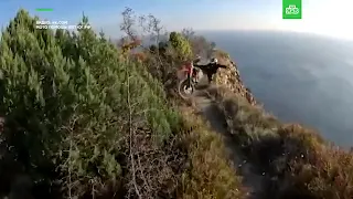 Motorbiker falls off cliff