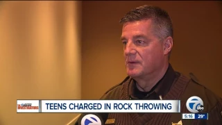 Teens charged in rock throwing