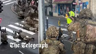 British soldiers seen firing guns on suburban French streets