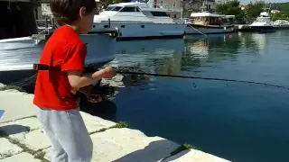 3,5 year old catching his first fish on a lure - drops the rod scared of fish!