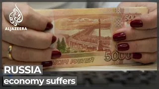 Russia sees sanctions hit with currency value drop