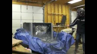 Breaking a 40" Sony Trinitron XBR TV with a hammer.