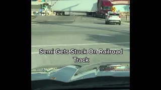 Semi truck gets stuck on Railroad track and this happens