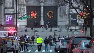 Witness describes chaos at Manhattan cathedral when gunman opens fire after Christmas concert