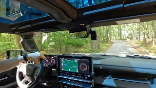 Hummer EV SUV Driving on Stone Mountain Park Roads