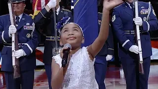 Six-year-old Victory Brinker sings the anthem before the Jazz game