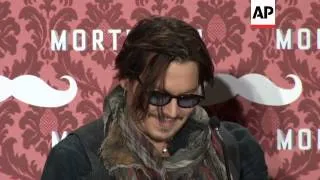 Johnny Depp and Paul Bettany at Mortdecai presser