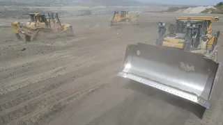 A Team Of Four Caterpillar D9T & Komatsu D275AX Bulldozers Levelling An Enormous Mining Site