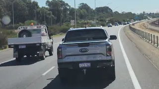 These two need to stop and have a chat, not do it whilst holding up the freeway.