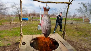 We cook 15 kg of carp with caviar in an earthen tandoor in the village.