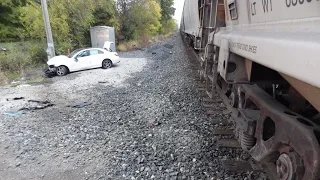 Mother, high school students able to run away from car stuck on tracks moments before train hits it