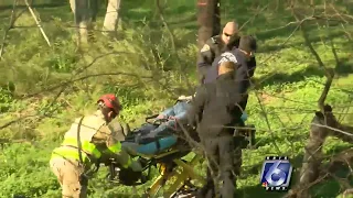 Woman rescued after flipping her car into watery ditch