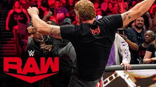 Edge brawls with Damian Priest through the Cleveland crowd