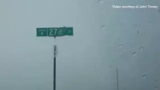 Raw: Storm chasers make it through rain-wrapped tornado