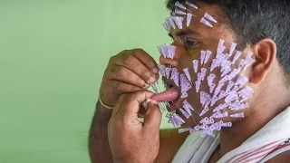 Performer Inserts Hundreds Of Surgical Needles In His Head