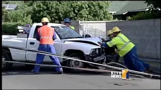 Car takes down four electric poles