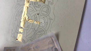 Painting and applying gold leaf to an illuminated letter