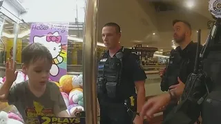 Toddler gets stuck in claw machine, Police break glass to get him out