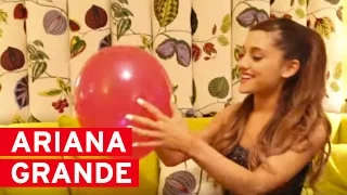 Ariana Grande pops balloons to answer YOUR questions