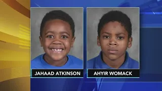 Family mourns loss of 2 boys killed by passing train during vigil