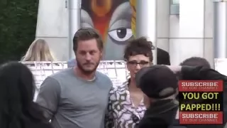 Travis Fimmel greets fans arriving to the Magie's Plan Premiere at ArcLight Theatre in Hollywood
