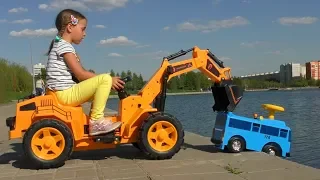 Sofia on toy Excavator Helps the  Little Bus on Сhildren's park