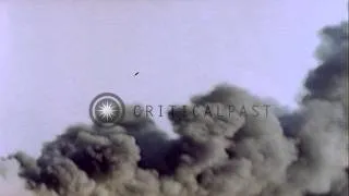 USS Ommaney Bay (CVE-79) burns at sea off shore of Luzon, Philippines following a...HD Stock Footage
