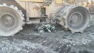 ATV GETTING CRUSHED BY DOZER