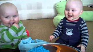 baby twins laughing at fake sneezes