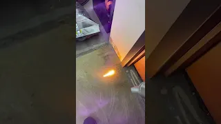Laser removing rug glue from concrete floor