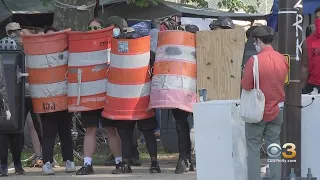 City Officials, Homeless Encampment Organizers Hold Last Minute Negotiation Session