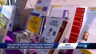 Volunteer group hands out banned books at Johnston Farmers Market