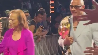 The Rock leaving ringside with Muhammad ali wife off air at WWE Hall of fame 2024