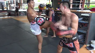 Saksurin hitting pads with Kru Chok