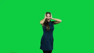 Happy excited girl pointing promoting in front of the green screen