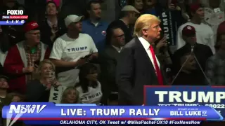 A Protester Wearing A KKK Shirt At A Trump Rally Gets OWNED