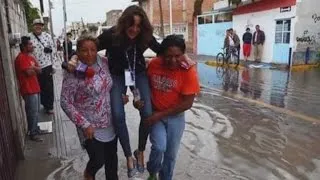 TV Reporter Fired After Being Carried Over Floodwaters to Keep Shoes Clean