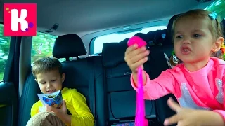 Katy and Max play with slime in the car