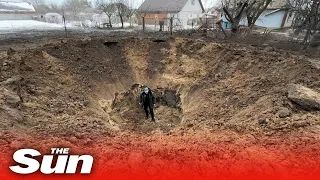 Russian rocket hits residential area outside Kyiv and makes massive crater