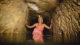 Watch This Bikini-Clad Surfer Explore Catacombs Lined With Skulls