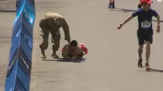 US vet crawls final metres of Boston Marathon after legs lock up