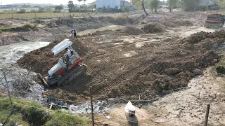 Amazing bulldozer push land into the mud