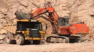 Hitachi EX1200-5 loading dump trucks