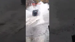 Land Rover Defender vs Discovery splash at Rufford