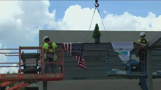 More than just a building: Final beam placed at new Wayman Palmer YMCA in topping off ceremony